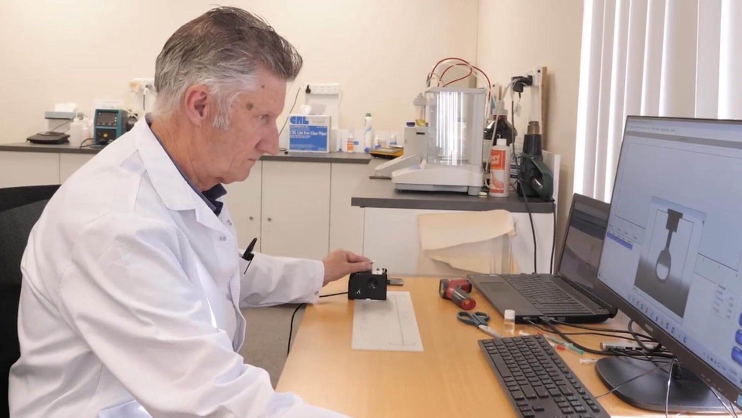 EnduroShield chemist testing coating for water repellency and durability